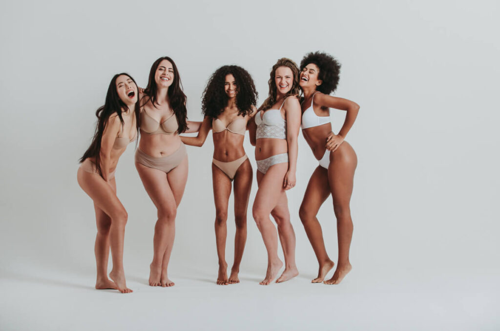 Multiracial group of women with different body and ethnicity posing together