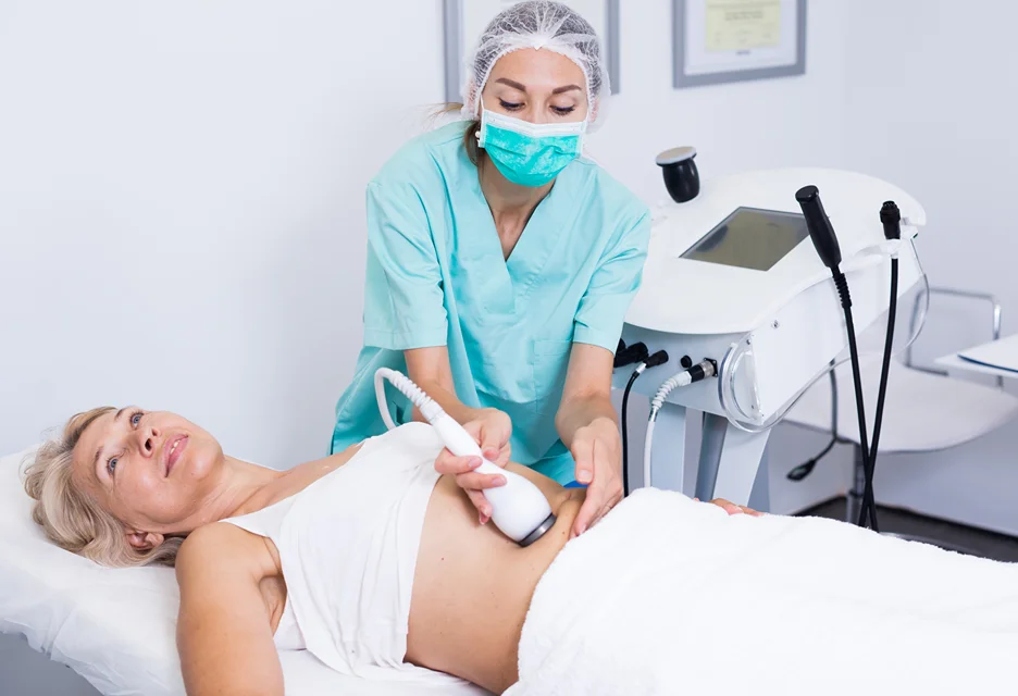 a woman getting coolsculpting on tummy